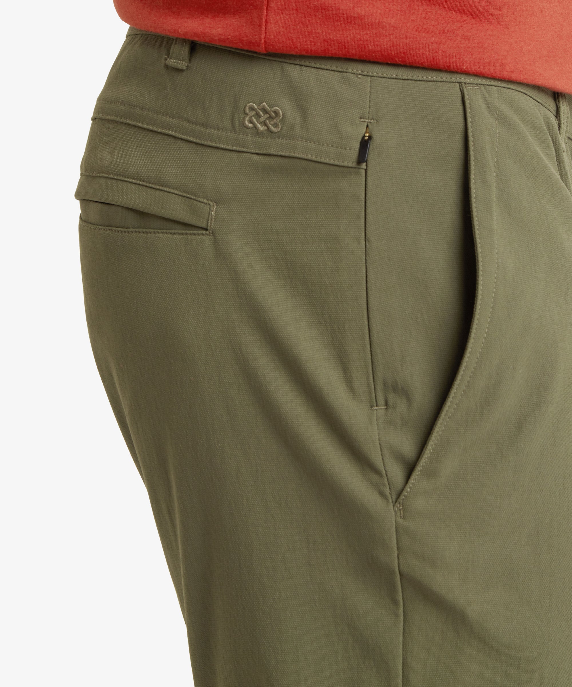 A side-angled view showing the Sherpa Adventure Gear Bara Shorts in Greens’ side pockets and the relaxed yet structured fit. The image emphasises the shorts' durability and practicality while maintaining a fashionable look.