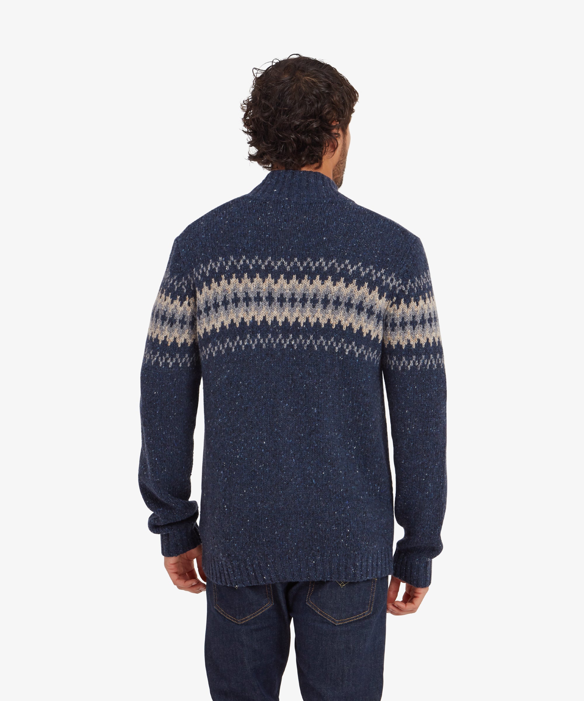 A view of the back of the Sherpa Adventure Gear Dumji Full Zip in Blue, showing the patterned stripe extending across the shoulders and the plain knit design on the lower back. The high collar provides additional warmth and style.