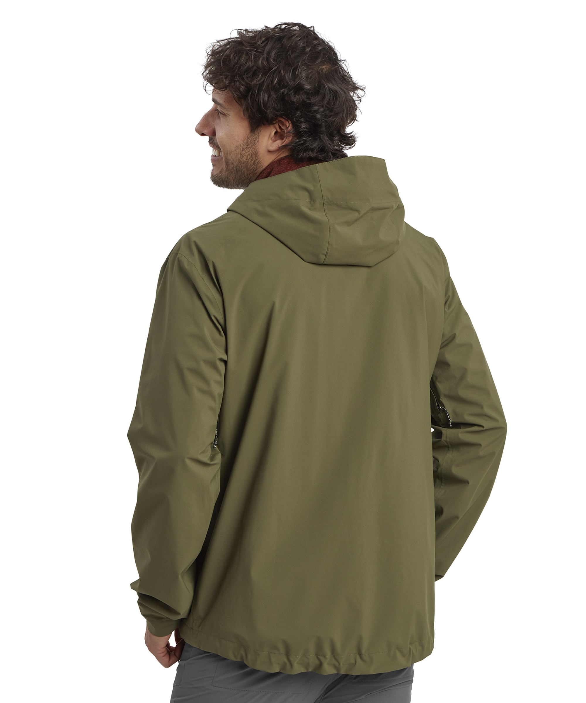 A rear view of the jacket, highlighting its clean, streamlined design. The hood falls naturally against the back, demonstrating its versatility when not in use. The man’s relaxed posture complements the practical yet stylish design of the jacket.