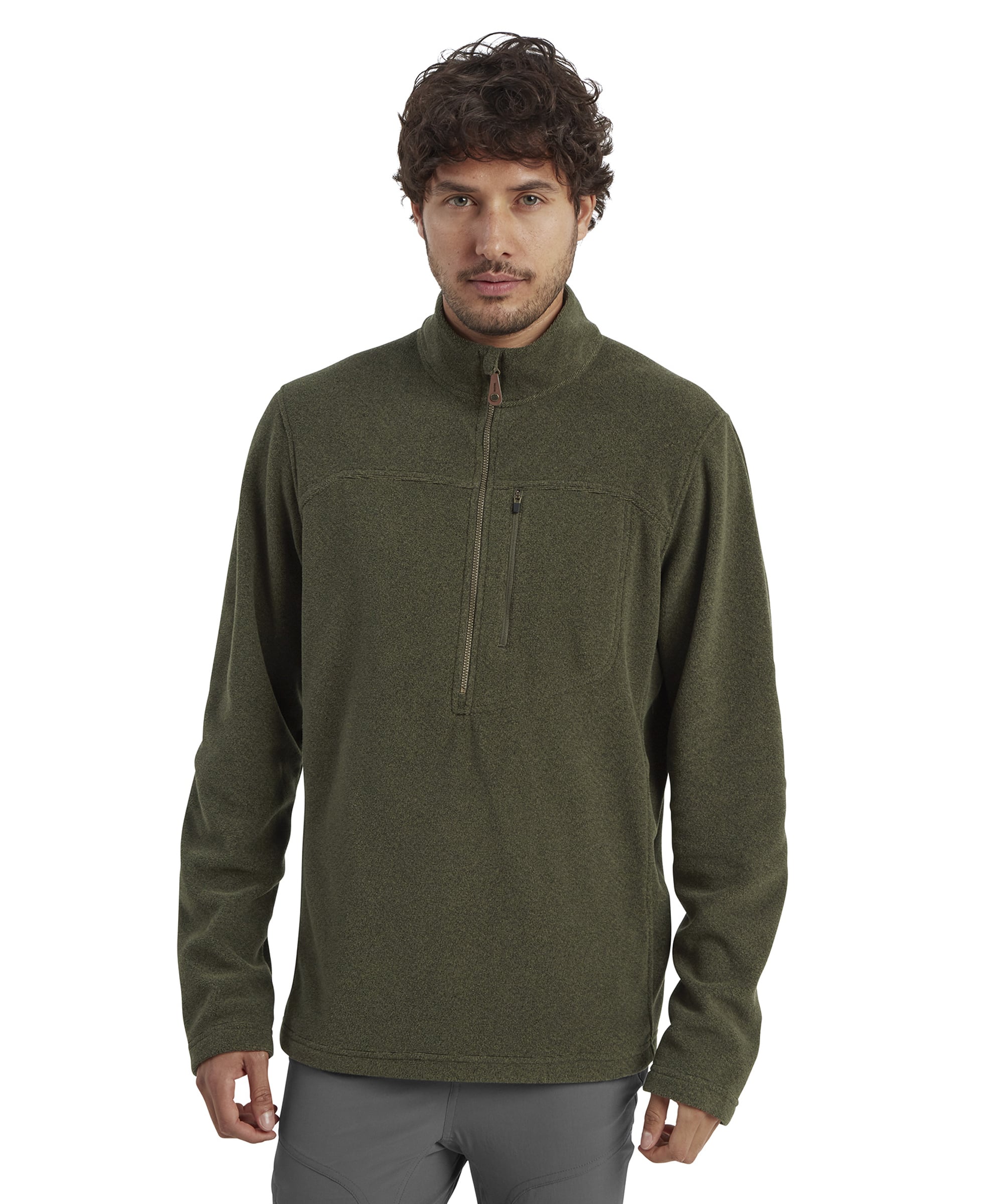 A front-facing image of a man wearing a Sherpa Adventure Gear Rolpa Eco Quarter Zip in Green. The quarter zip features a clean design with a high collar and a chest zipper pocket. The fabric has a subtle textured appearance, ideal for casual or outdoor wear. The man has a neutral expression and wears gray trousers.