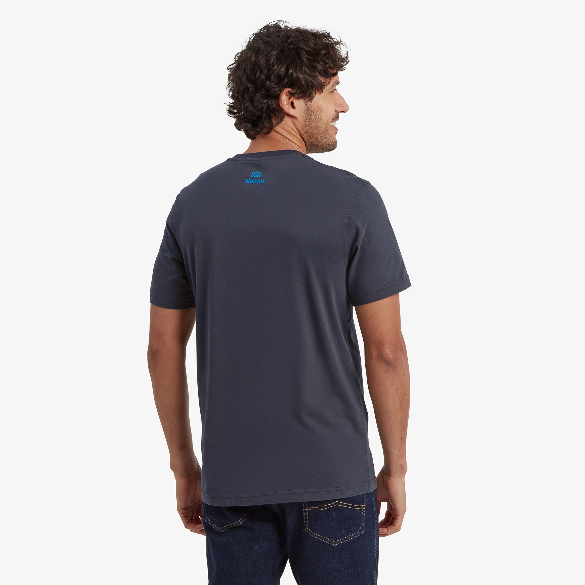 The Sherpa Adventure Gear Tarcho T-Shirt in Grey from behind, showing a small blue Sherpa Adventure Gear logo centered at the upper back. The fit is slightly tapered, emphasising the casual and comfortable style.