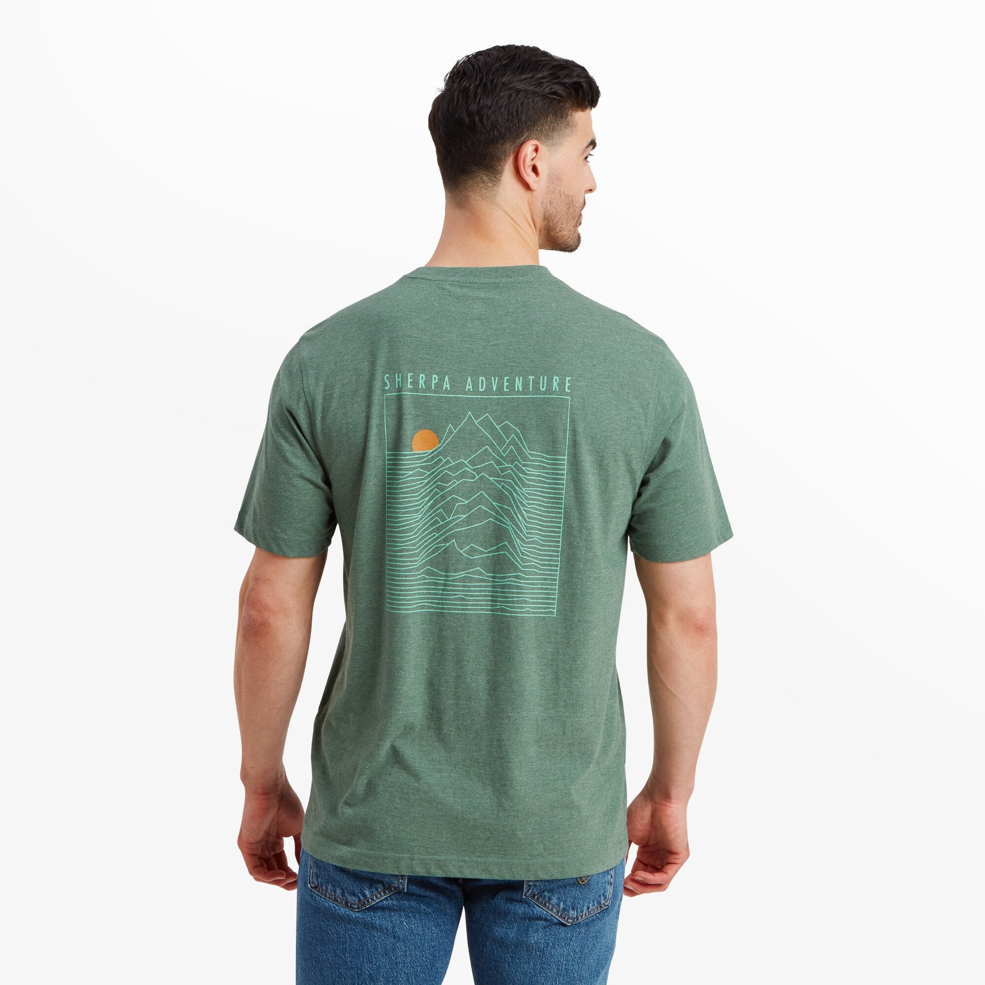 The back of the Sherpa Adventure Gear Terrain T-Shirt in Green features a bold Sherpa Adventure graphic—a mountain landscape outlined in fine, minimalist lines with a sun in the top left corner. The words "Sherpa Adventure" are written above the graphic.