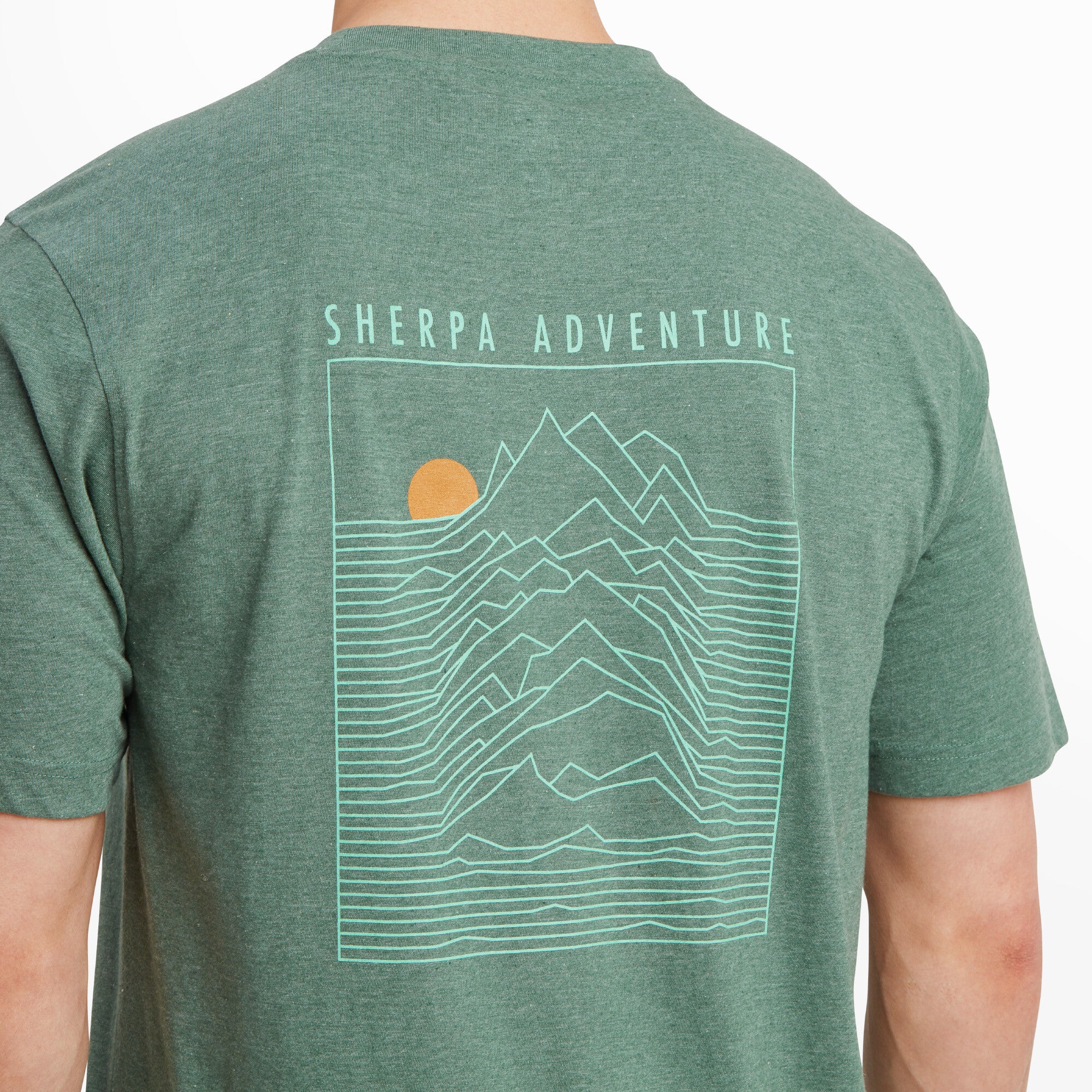 A detailed view of the back design on the Sherpa Adventure Gear Terrain T-Shirt in Green. The mountain outlines and the rising sun are showcased, along with the "Sherpa Adventure" branding, highlighting the intricate details of the print.