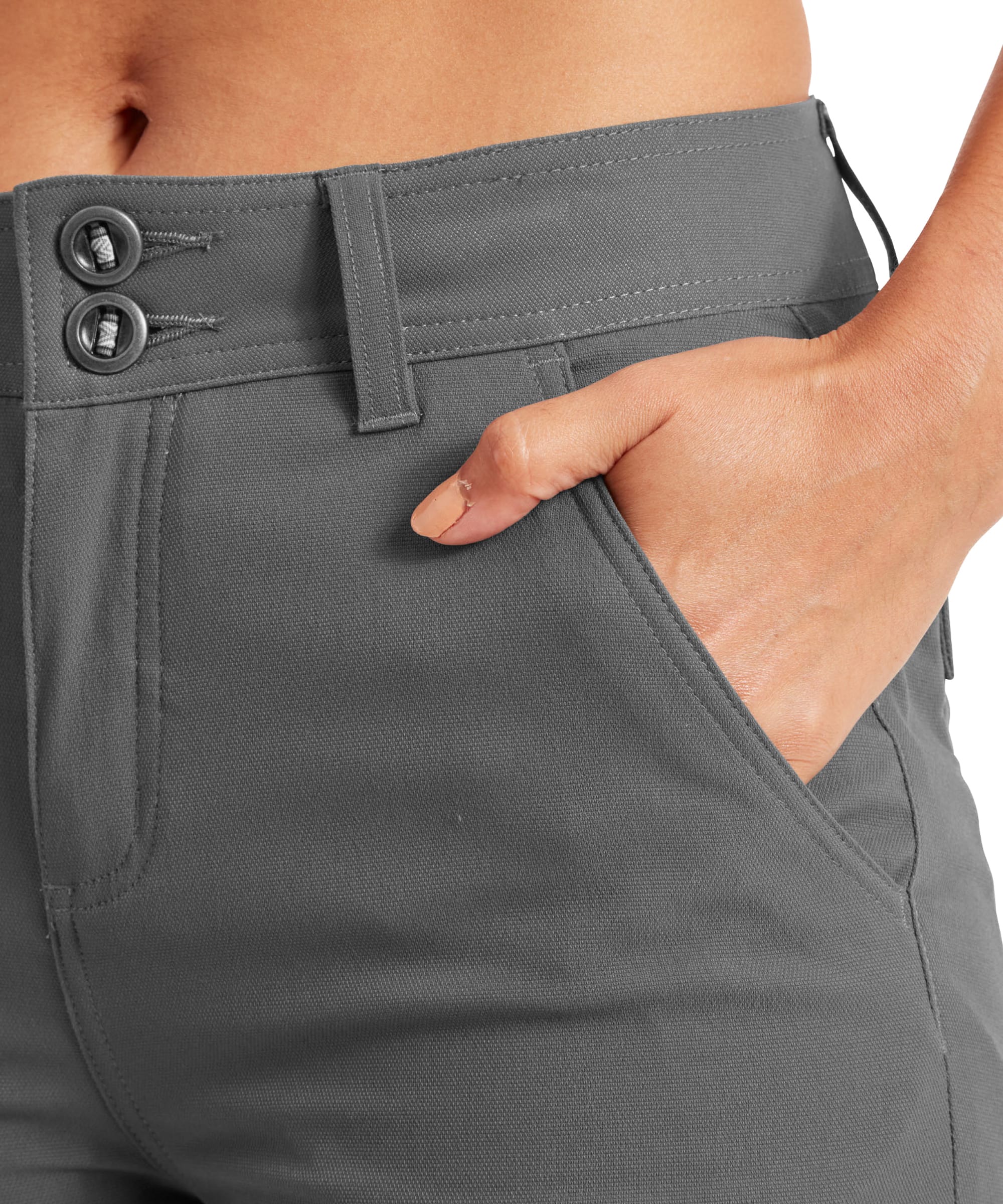 Close-up of the waistband area of the Sherpa Adventure Gear Bara Tapered trousers in Grey, emphasising the two-button detail and the functional side pockets. The smooth fabric and precise stitching enhance the tailored and sleek look.