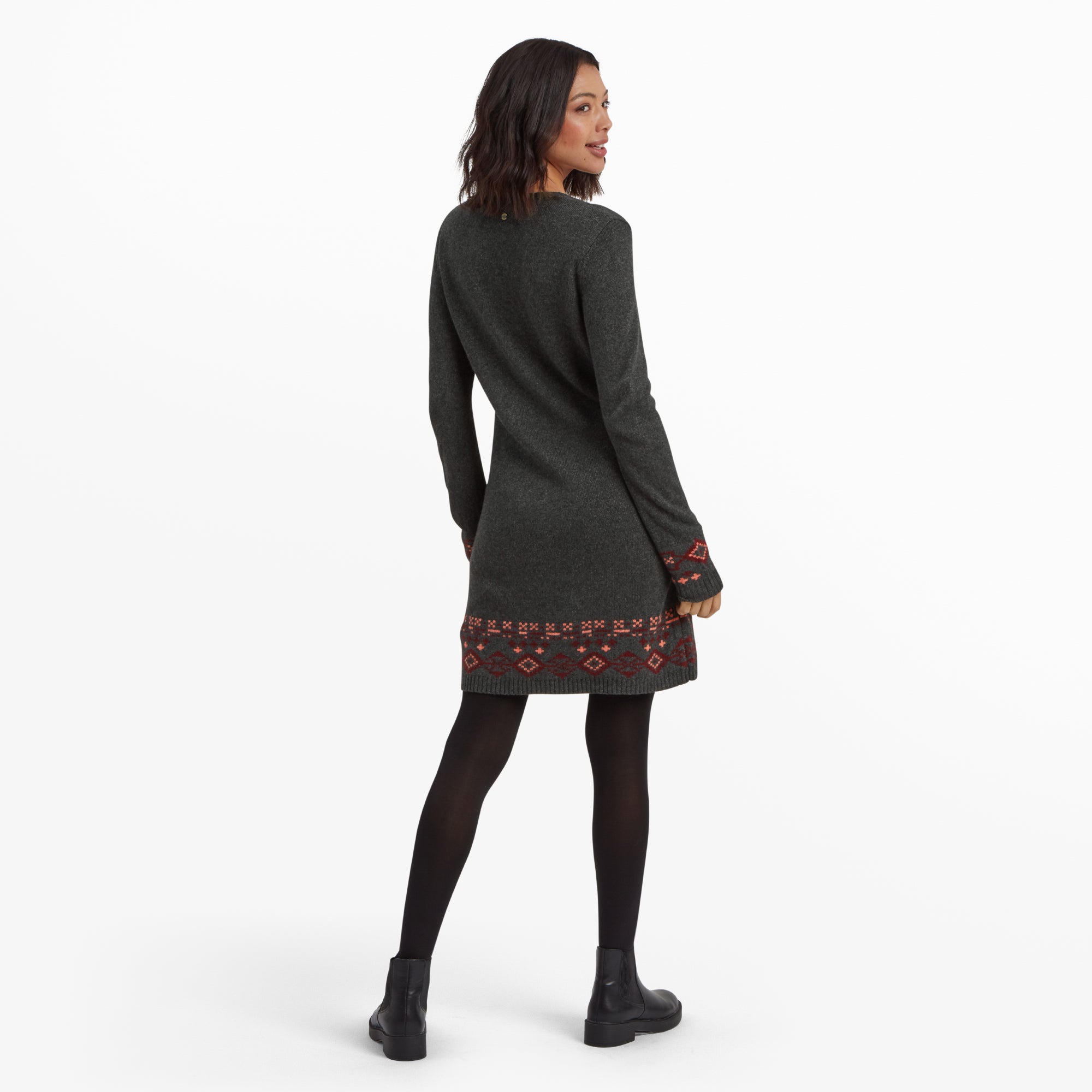 A back view of the Sherpa Adventure Gear Bharati Eco Dress in Grey, highlighting its seamless design, the continuation of the geometric pattern at the hem, and the slim fit of the sleeves.