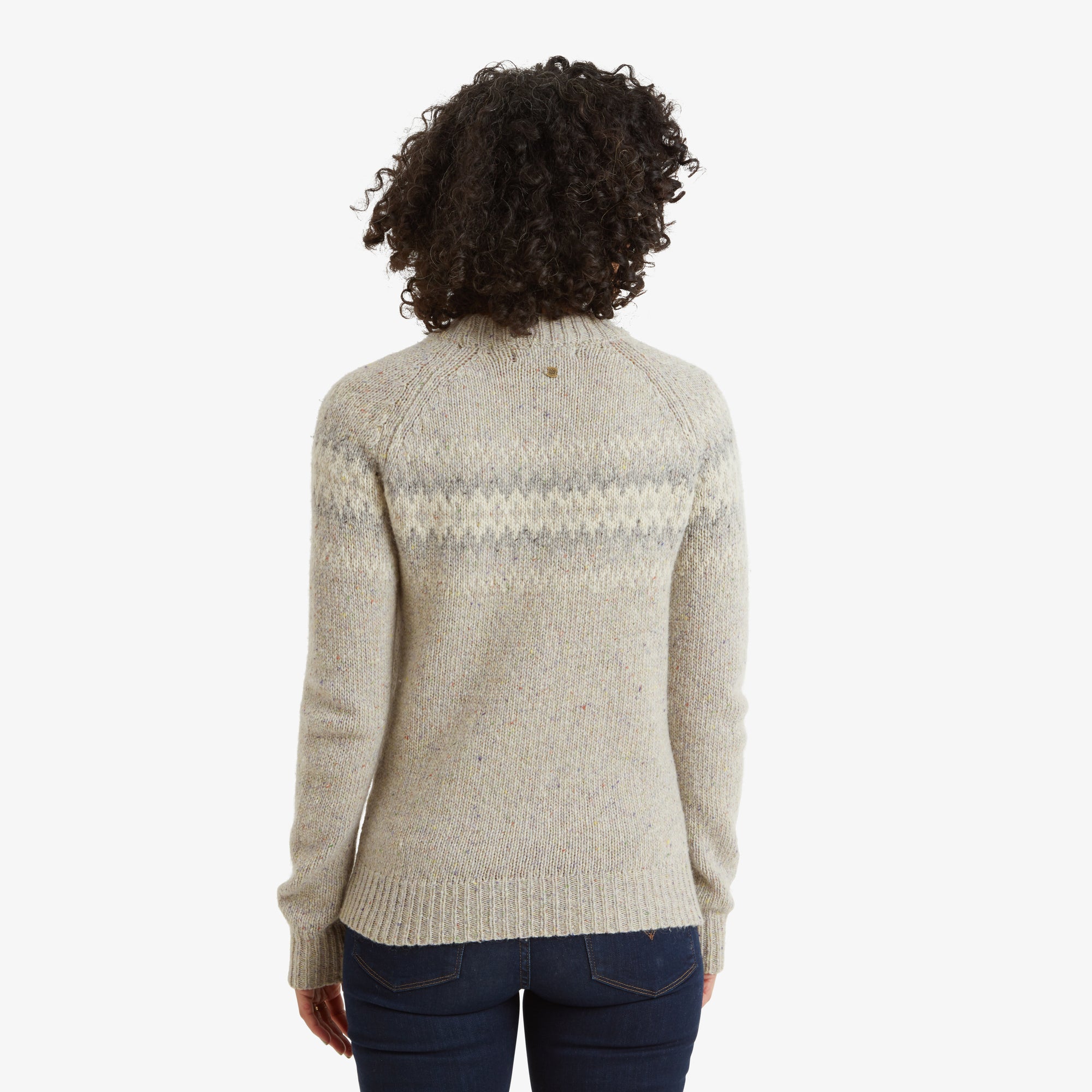 A clear look at the back of the Sherpa Adventure Gear Dumji Crew Sweater in White reveals the full wraparound design of the geometric pattern across the shoulders. The ribbed hem and cuffs stand out, and the overall fit is slightly relaxed, emphasising comfort.