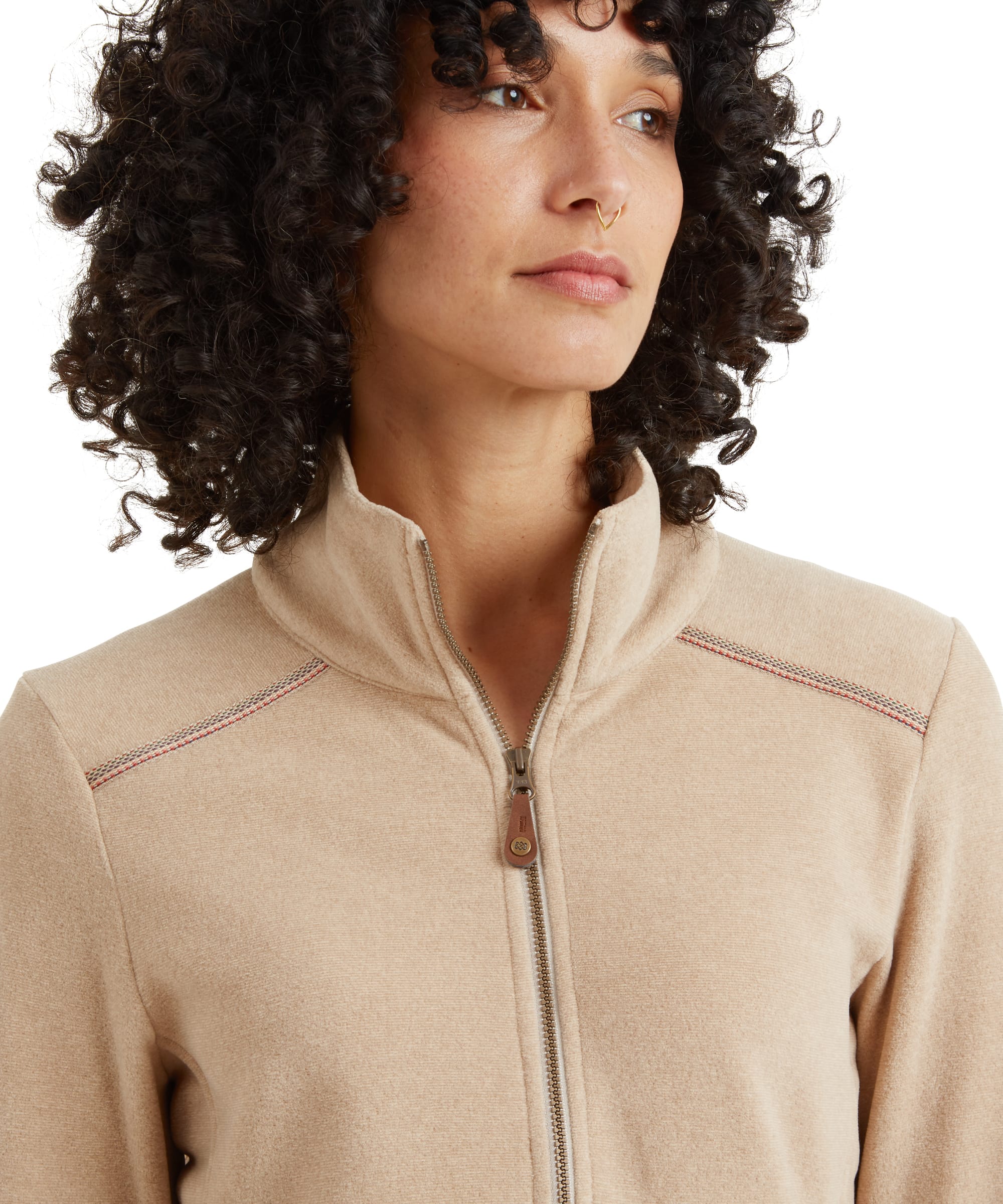 The final image showcases the functional side pocket of the Sherpa Adventure Gear Rolpa Eco Pullover Zip in Beige. A hand is casually placed inside the pocket, demonstrating its convenience. The fleece fabric and stitching are also clearly visible, emphasising the texture and craftsmanship.